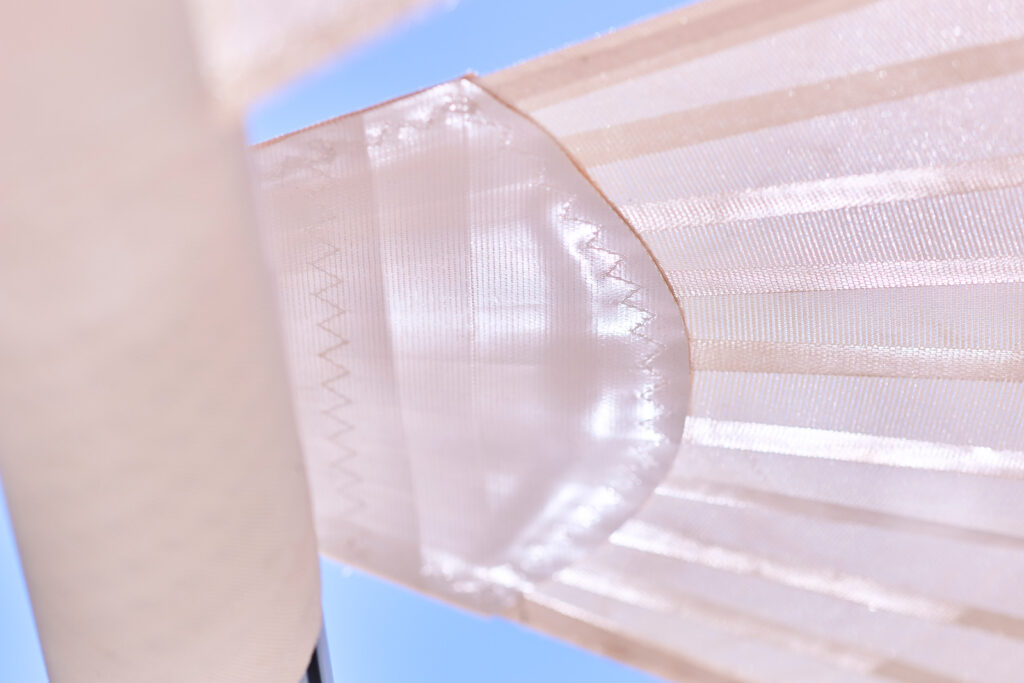 Soltis 92 waterproof sun sail fabric by Serge Ferrari — water beading on surface, UPF 50+
