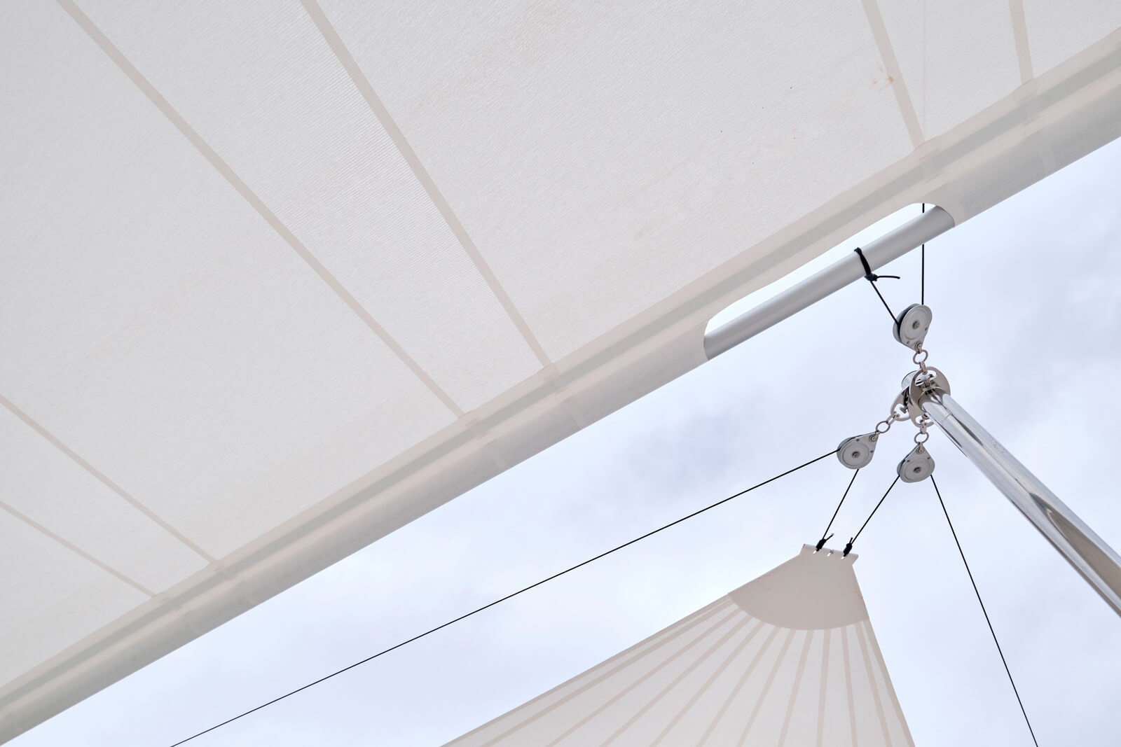 Shot of Sun Sail 80 m² fully deployed over Son Vida villa Mallorca — sail fabric luminous light