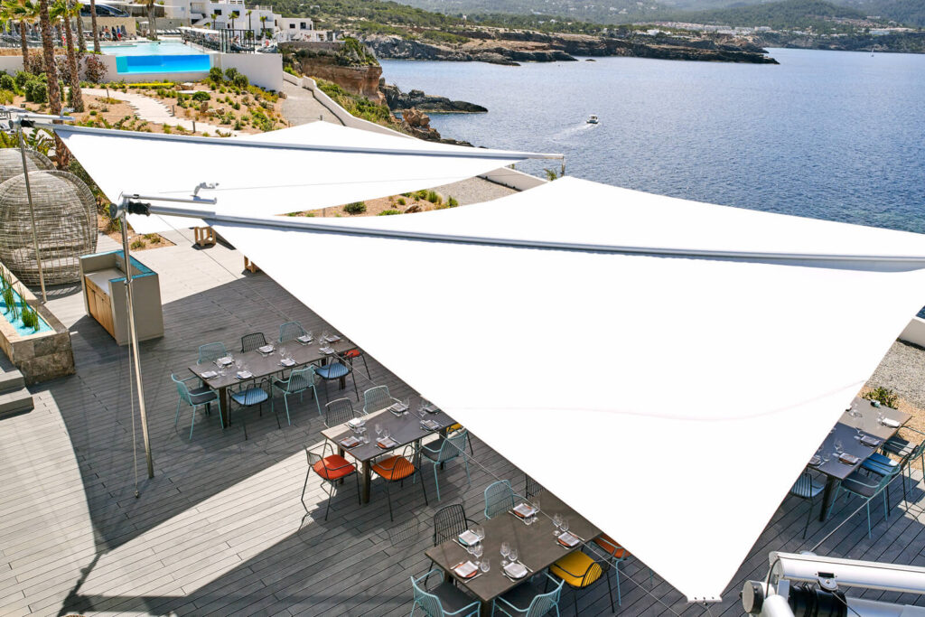 Sun Sail commercial installation on Balearic island hotel terrace — island-specific wind and design considerations across Mallorca, Ibiza, Menorca and Formentera