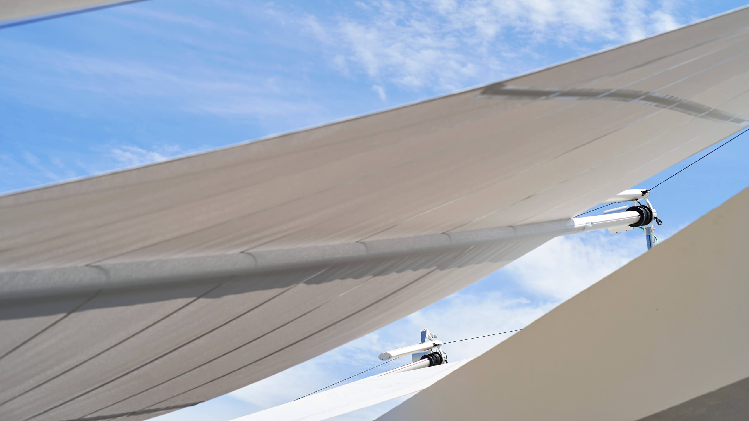 Sun Sail automatically retracting on Mallorca villa terrace — patented wind sensor system in operation since 1993, 15,000+ global installations